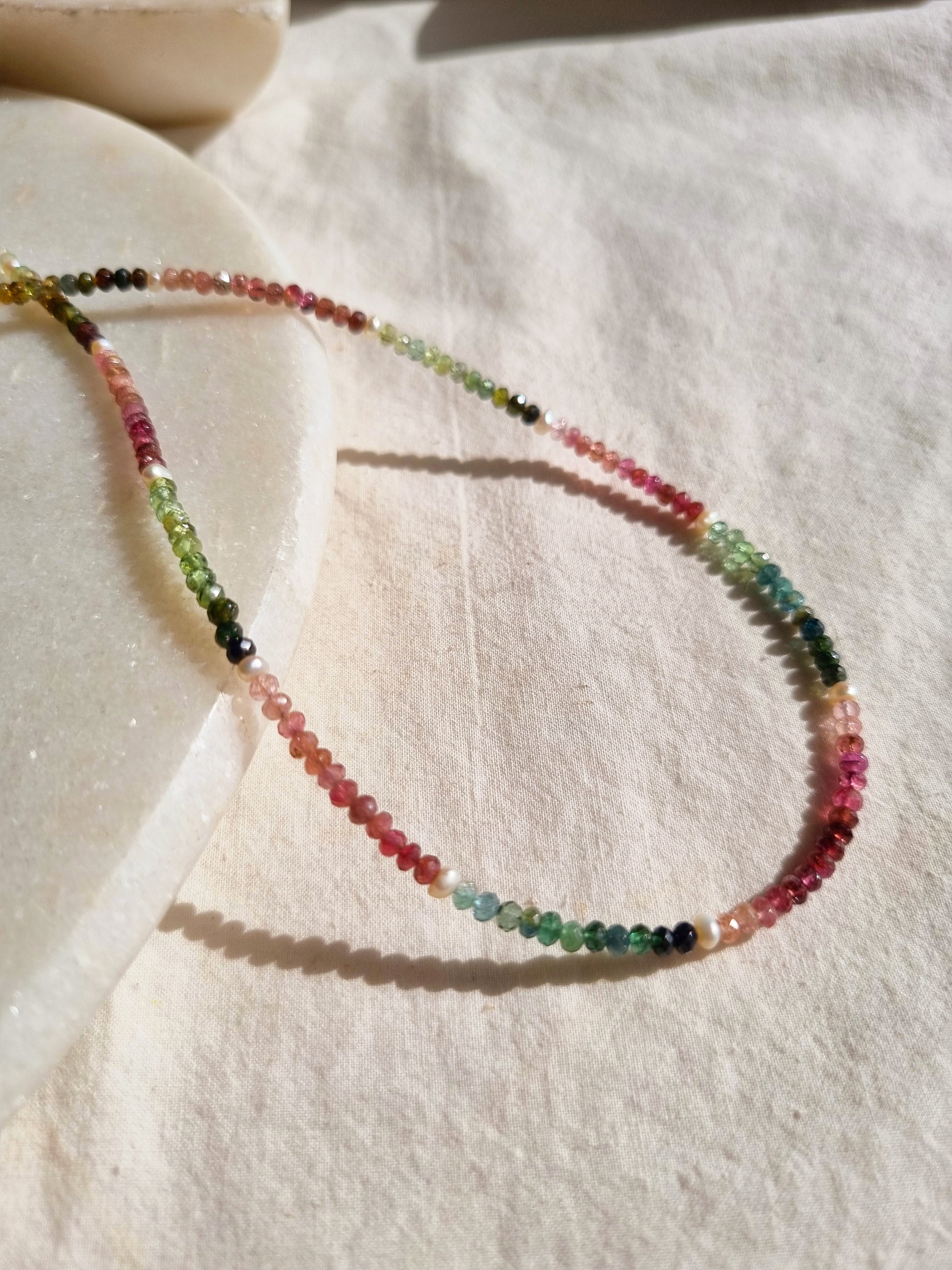 string of beads | माला