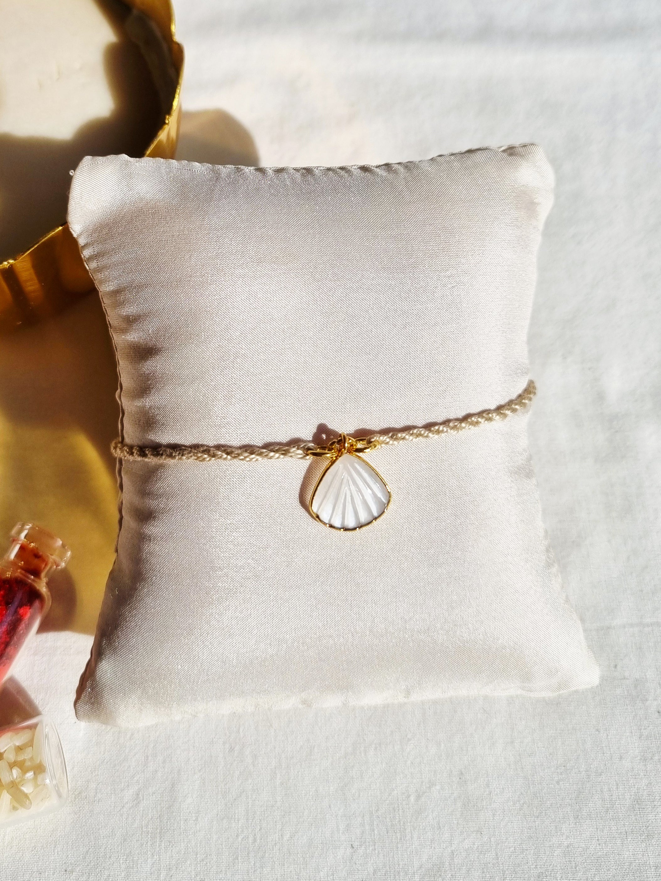 sankha- White Moonstone Shell Charm Rakhi