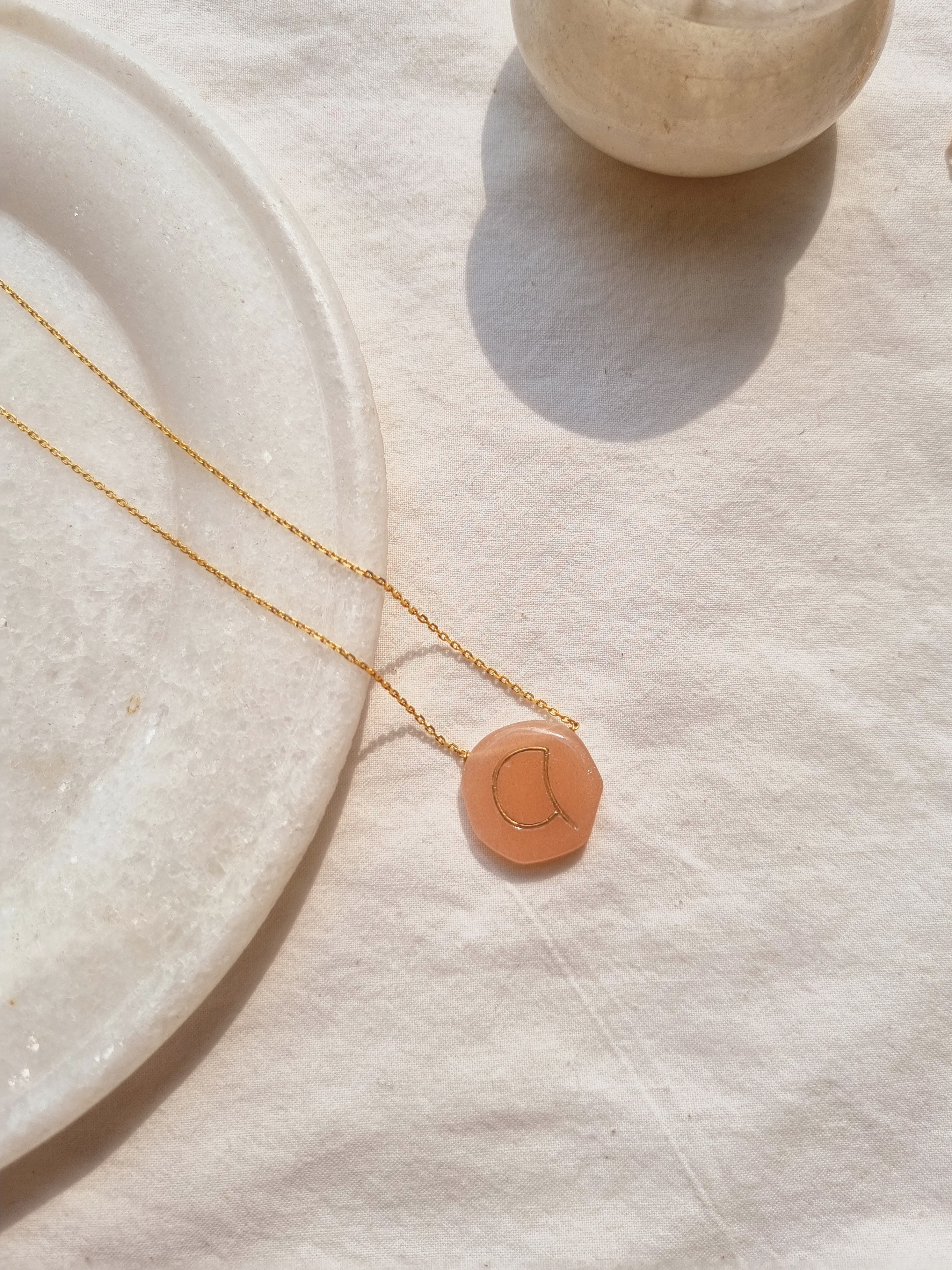 mriyan - Peach Moonstone Pebble with Embossed Initial