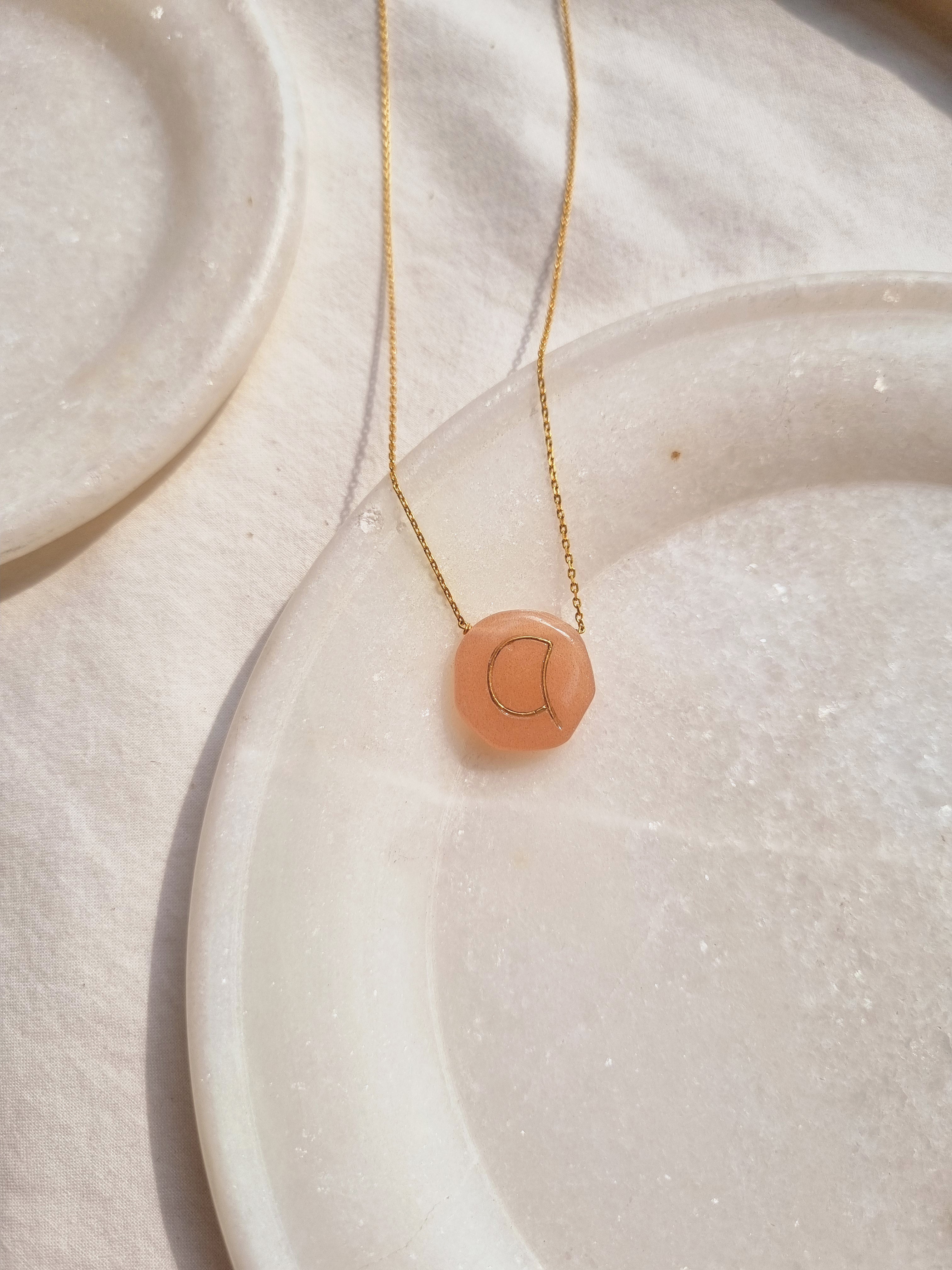 mriyan - Peach Moonstone Pebble with Embossed Initial