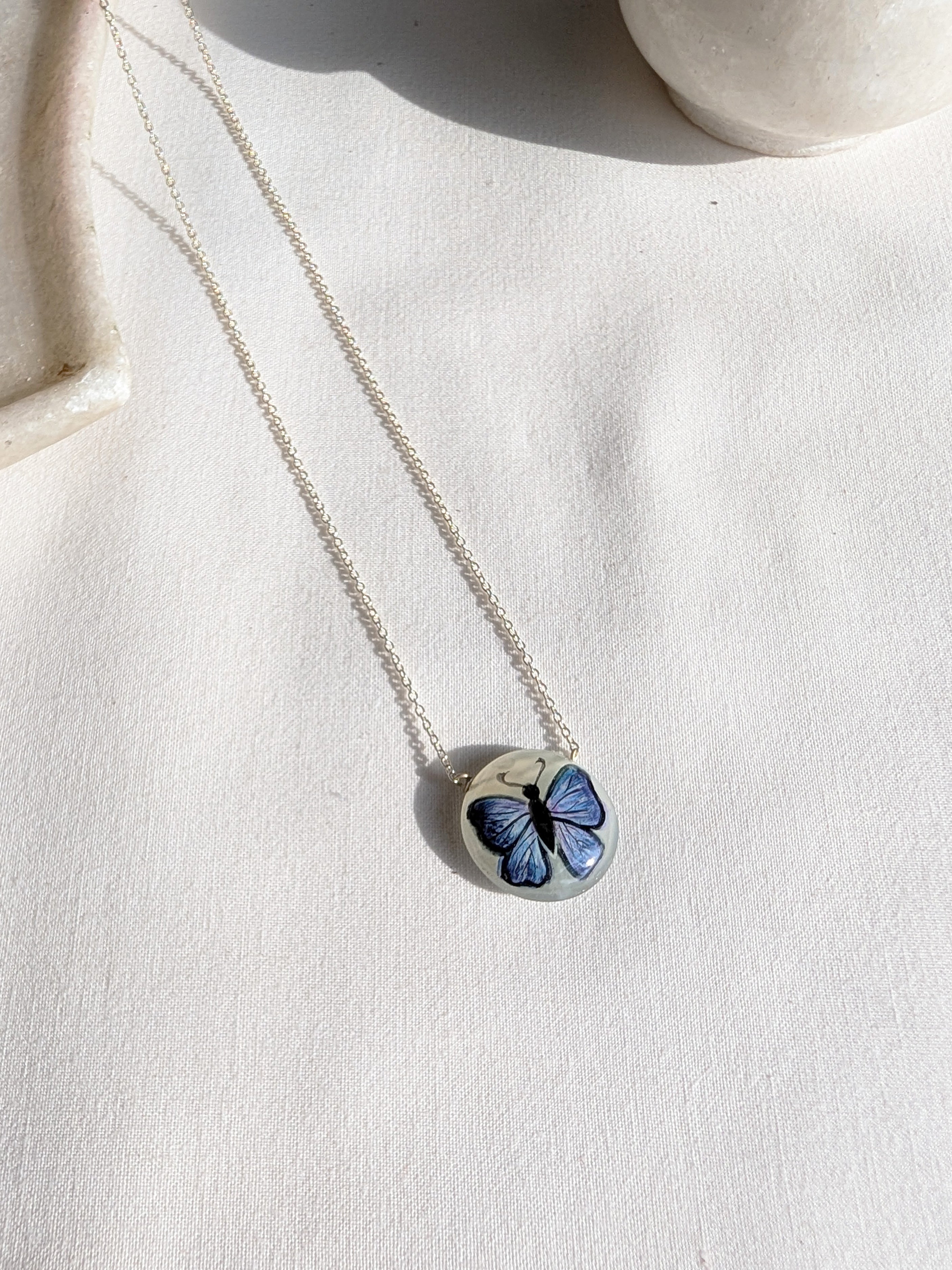 titálee - Butterfly hand painted on Moonstone